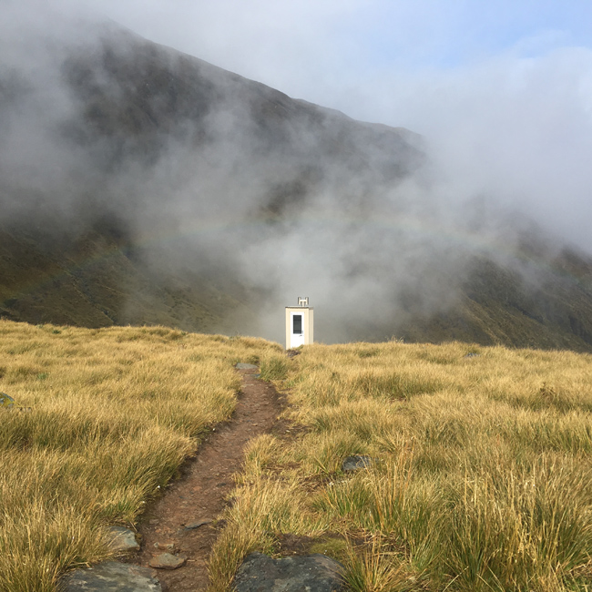 Rainbow over the long drop at Brewster Hut